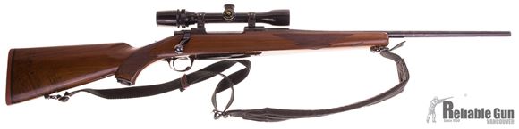 Picture of Used Ruger M77 7x57 Bolt Action Rifle, Tang Safety, Blued. Walnut Stock,  Ruger Rings, Bushnell 2.5-8 Scope, Stock Shows Hunting Wear Otherwise Good Condition