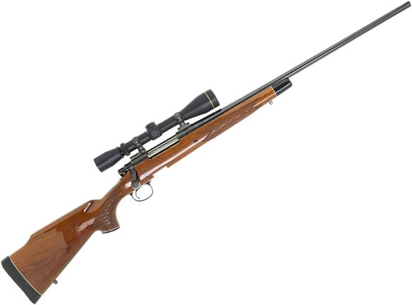 Picture of Used Remington 700 BDL Bolt Action Rifle - 7mm Rem Mag, Gloss Blued, Engraved Receiver, Gloss Finish Wood Stock, VX-II 3-9x40mm, 1 Magazine, Bag of Accessories, (Some Finish Wear @ Pistol Grip) Otherwise Very Good Condition