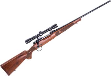 Picture of Used Winchester Model 70 Featherweight Bolt-Action Rifle, 30-06, 22" Barrel, Gloss Blued, Walnut Stock, Redfield 4X Scope, Post 64 Manufacture, Fair Condition