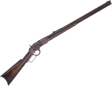 Picture of Used Winchester 1873 Lever Action Rifle, 38 Cal 24'' Octagon Barrel w/Sights, Crescent Butt Plate, Stock And Forend Cracked, Barrel Is Pitted, Dust Cover is Loose, 1883 Mfg. Poor Condition